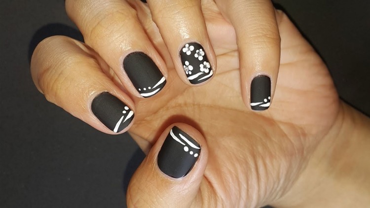 I used Gel Polish to hand painted the Mickey/Minnie mouse on Shellac manicure