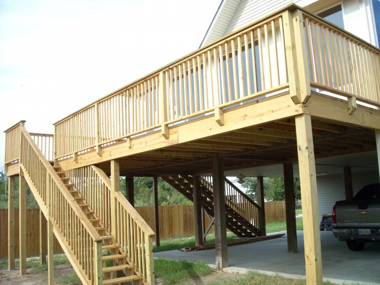 This raised wooden deck in the backyard is actually a pool cover